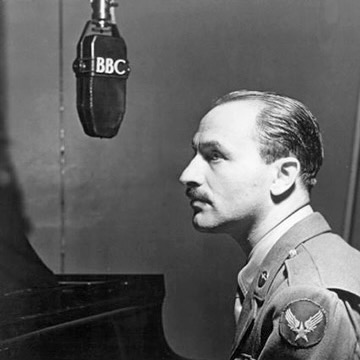 Marc Blitzstein sitting in front of a BBC microphone