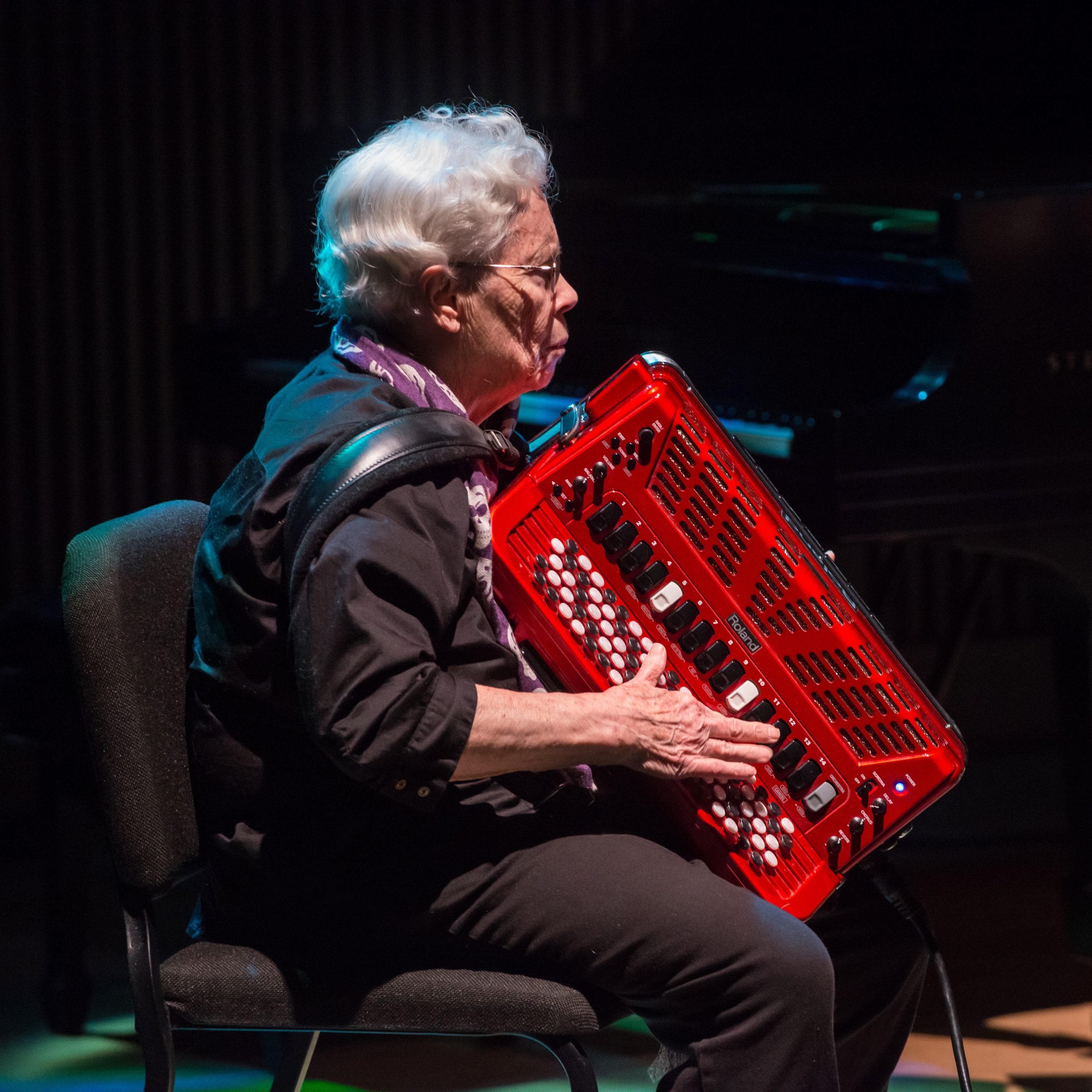 Pauline Oliveros playing accordion