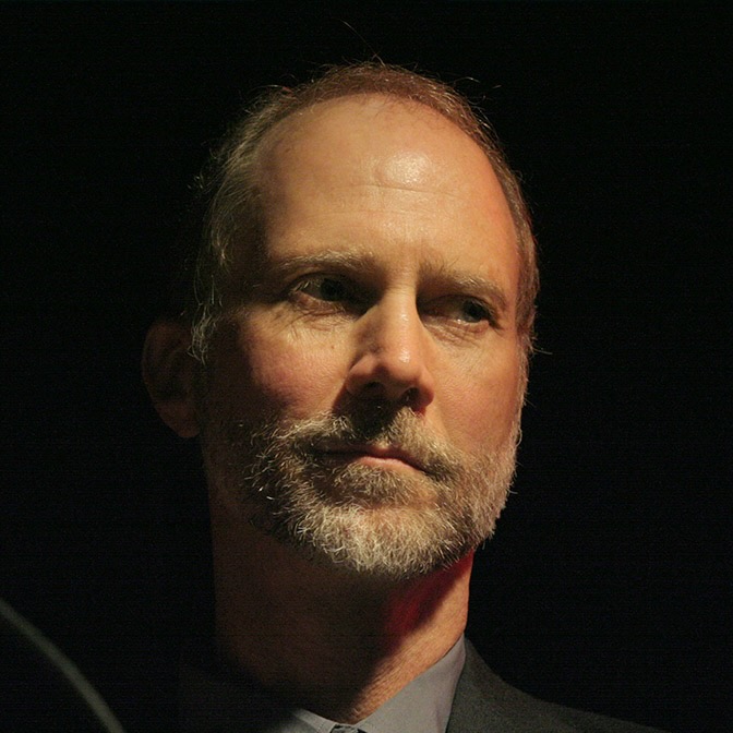 John Luther Adams with dark background