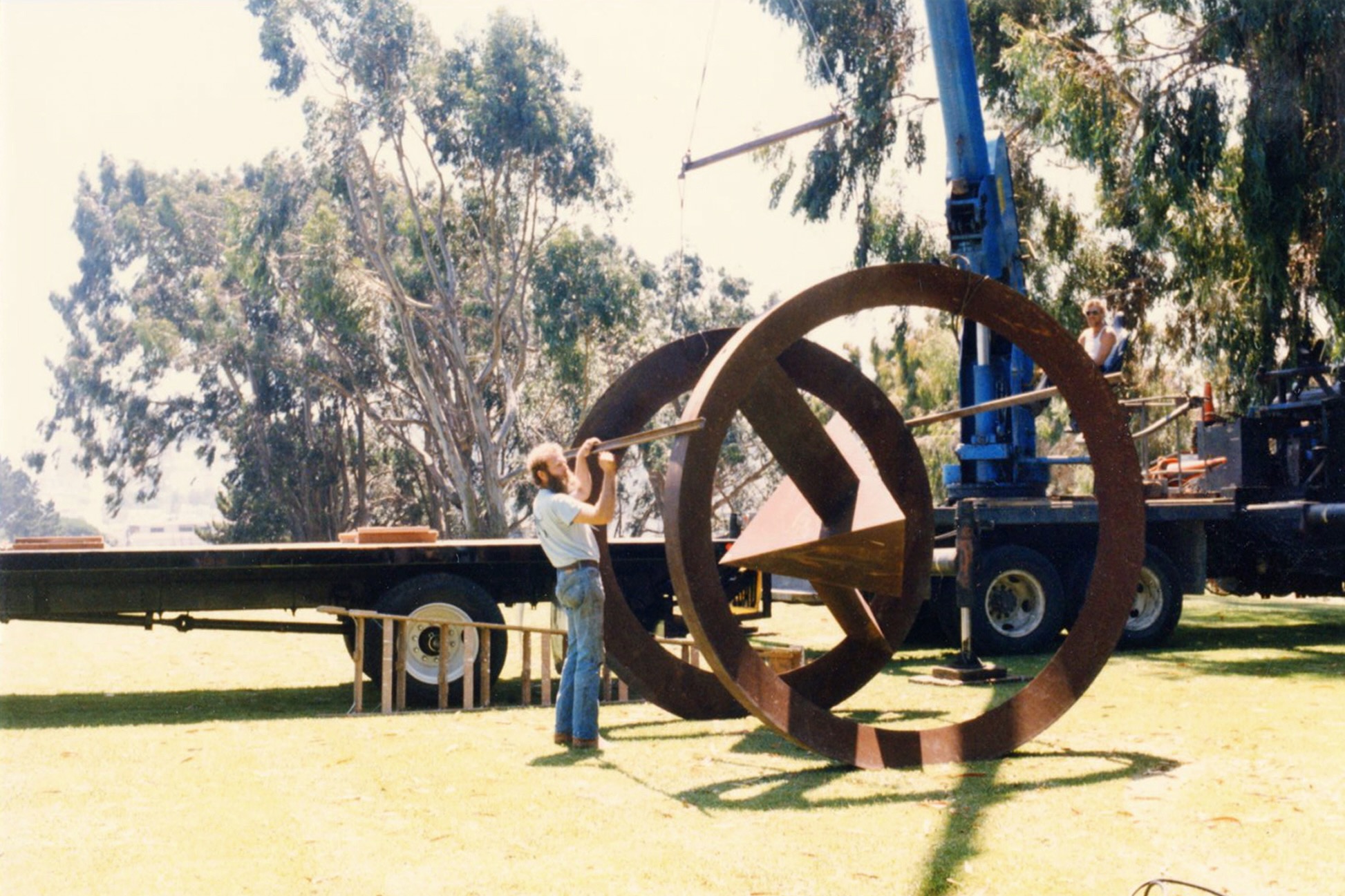 Scott Atthowe installing Bruce Nauman sculpture at Fort Mason, San Francisco.