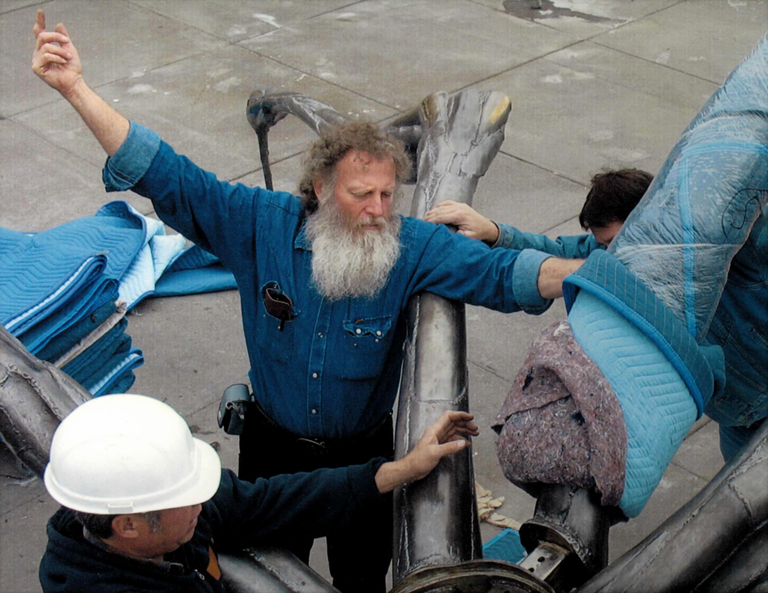 Scott Atthowe installing Louise Bourgeois sculpture “Crouching Spider" on the Embarcadero, San Francisco.